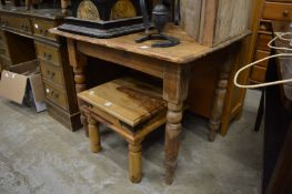 A pine kitchen table.