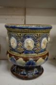 A Doulton vase with various moulded portrait busts of Kings and Queens.