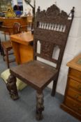 A large Palanese or Indonesian carved hardwood chair.