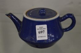 A small Chinese blue glazed teapot.