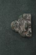 A small carved jadeite Buddha.