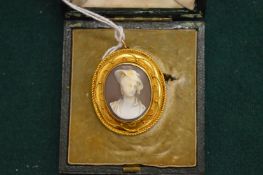 A yellow metal mounted cameo brooch converted to a pendant.