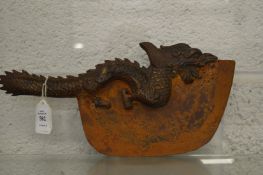 A Tibetan bronze dragon axe.