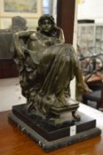 A good bronze figure of a seated semi nude female figure on a marble base, the bronze signed