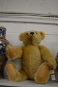 A large modern Steiff teddy bear.