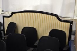 A large upholstered headboard, 2m long.