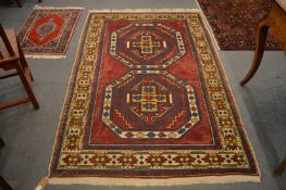A Persian design carpet, red ground with stylised decoration, 210cm x 130cm.