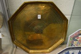 A large Eastern octagonal shaped brass tray with engraved decoration.