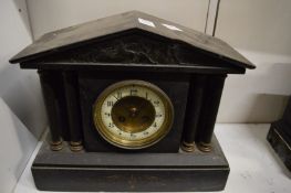 A slate mantel clock.