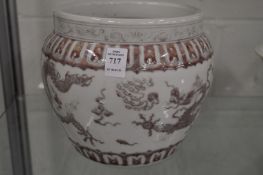 A Chinese red and white decorated porcelain dragon jar.
