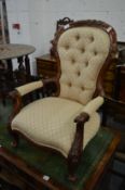 A child's Victorian style button back armchair.