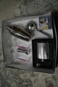 A cocktail making set and a boxed hip flask.