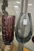 A Whitefriars amethyst glass bark vase and another glass vase.