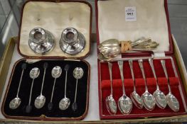 Two cased set of silver coffee spoons, various loose silver spoons and a pair of silver dwarf
