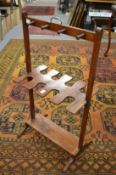 A 19th century mahogany boot and whip rack.