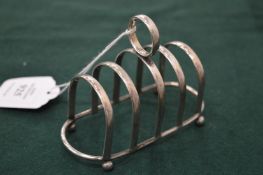A silver toast rack.