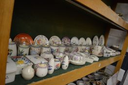 A good collection of Poole pottery preserve jars and other items.