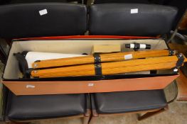 An astronomical telescope and tripod stand, boxed.
