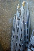 Five various aluminium step ladders.