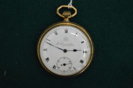 A gilt metal pocket watch.