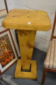 A pair of Art Deco style square shaped pedestal stands.