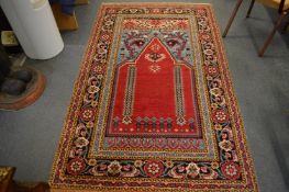 A Persian design prayer rug, 213cm x 128cm.