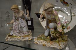 A pair of Meissen figures of a kneeling gentleman and lady (faults).