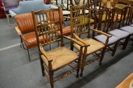 A pair of modern Lancashire style spindleback rush seated armchairs.