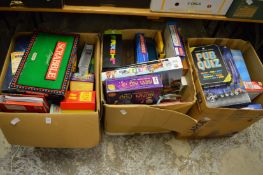 Three large boxes of puzzles and games etc.