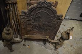 Old pair of cast iron fire dogs, cast iron fire back and a wrought iron grate.