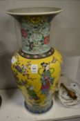 A large Chinese famille jaune baluster shaped vase.