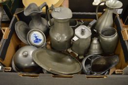 A pewter lidded flagon and other pewter items.