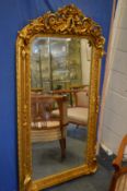 A decorative gilt framed pier mirror.