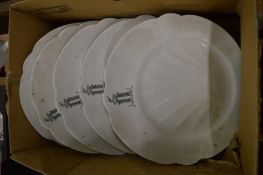 A set of six shell shaped plates, the border painted with an armorial.