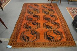 An Afghan gold ground rug, 240cm x 170cm.