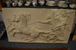 A moulded plaster plaque of a centurian and chariot.