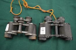 Two pairs of binoculars.