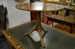 A 19th century tilt-top tripod table.