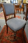 A set of six Victorian oak and upholstered dining chairs.
