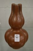 A Chinese brown glazed three neck tulip vase.