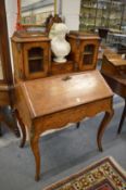 A good Victorian figured walnut and marquetry inlaid Bonheur du jour.