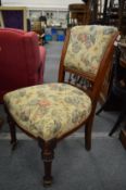 A set of six Victorian oak and upholstered dining chairs.