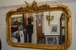 A good large decorative gilt framed over-mantel mirror.