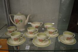 A Susie Cooper six place coffee service (one saucer repaired).