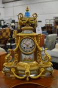 A good French ormolu mantel clock with Sevres panels.