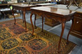 A good pair of Irish designed mahogany fold-over card tables, each with a green leather inset
