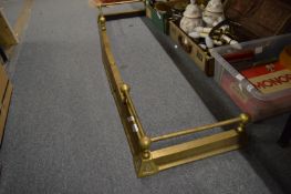 A brass adjustable fender.