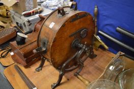 A late Victorian cast iron and oak knife polisher.