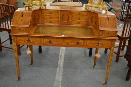 A very good Carlton House desk, 20th century, painted all-over with floral sprays, ribbons, bows and
