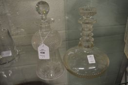 An engraved thistle shaped decanter and a port decanter.
